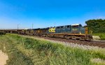 CSX 5203 leads an empty coal train.